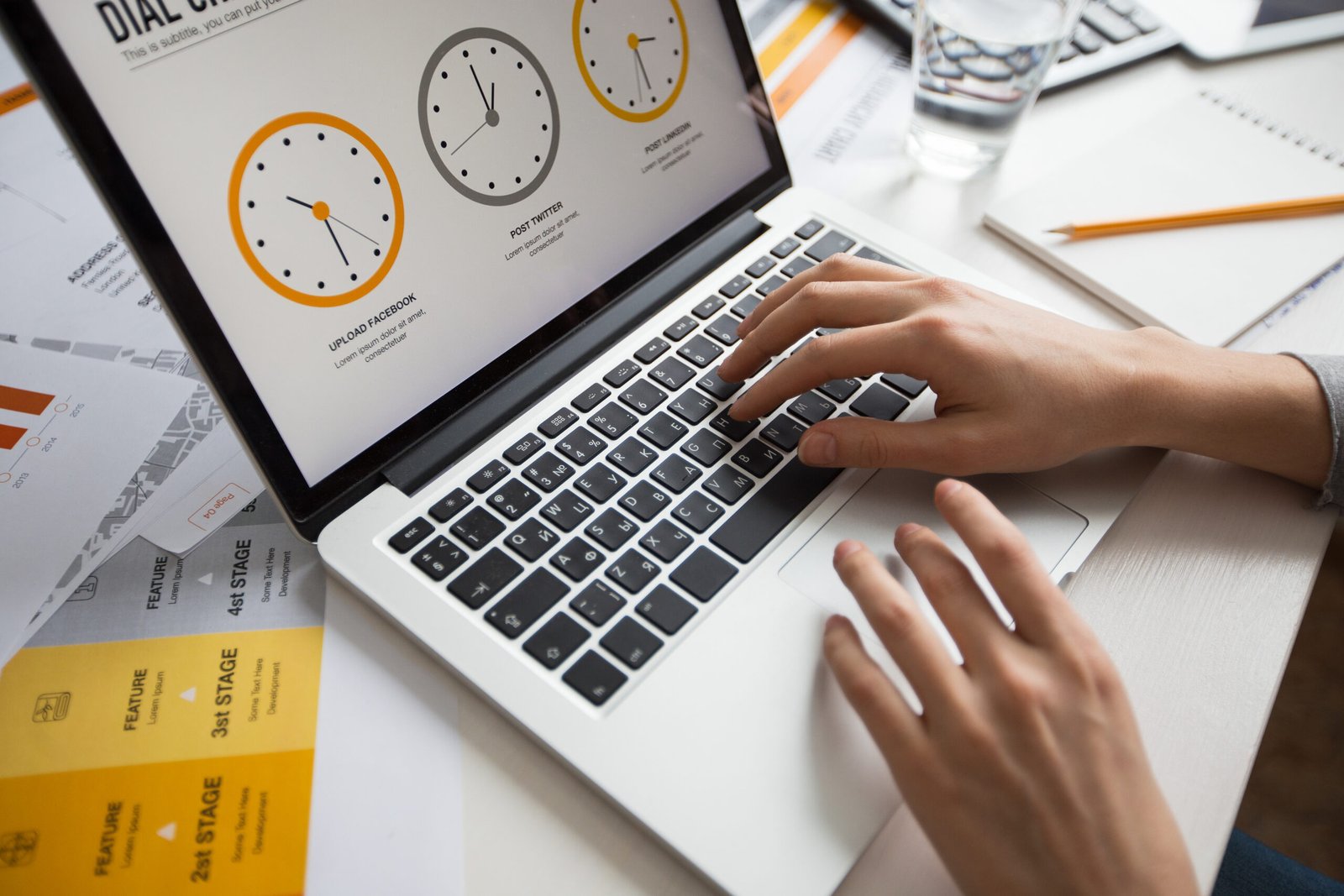 hands of businesswoman using laptop in office